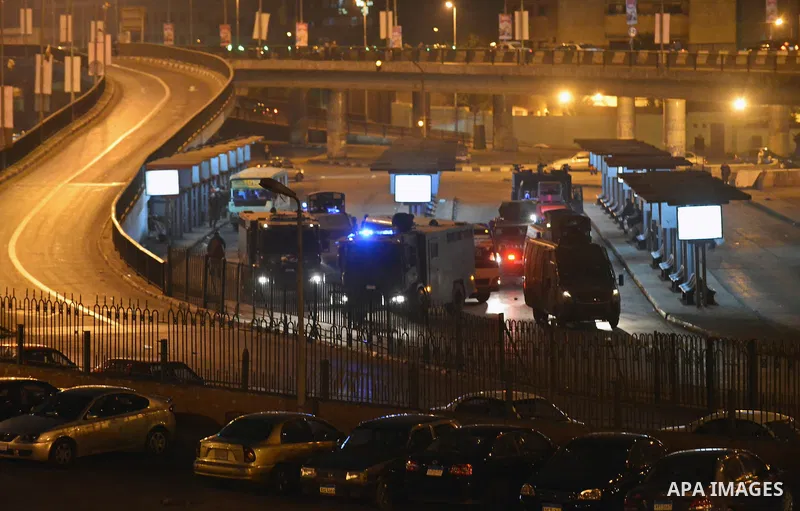 Egyptian riot police stand guard after disperse anti-Mubarak protesters at Abdel Moneim Riad, a main transportation hub for taxis and buses, after hearing the verdict of former Egyptian president Hosni Mubarak, in Cairo,...