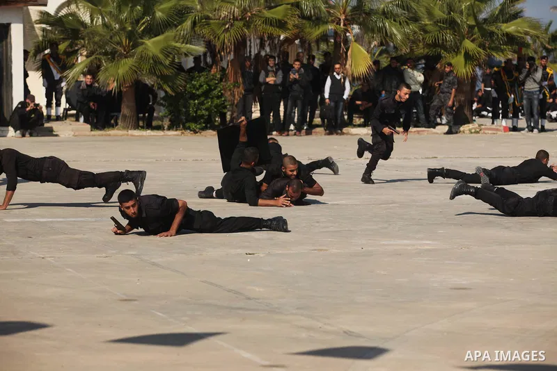 Palestinian members of officer display their skills during a graduation ceremony in Gaza city on November 30, 2014. Photo by Ashraf Amra