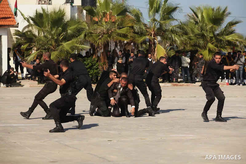 Palestinian members of officer display their skills during a graduation ceremony in Gaza city on November 30, 2014. Photo by Ashraf Amra