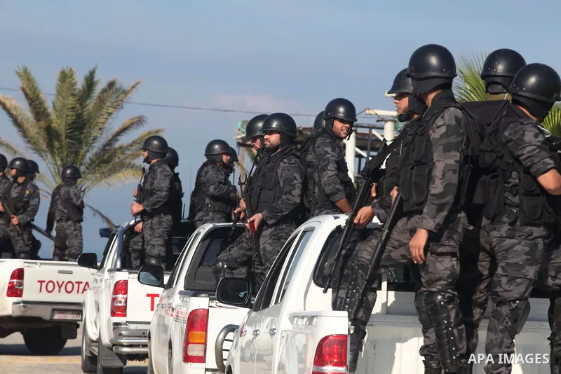 Palestinian members of officer display their skills during a graduation ceremony in Gaza city on November 30, 2014. Photo by Ashraf Amra