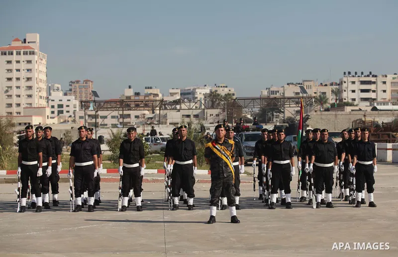 Palestinian members of officer display their skills during a graduation ceremony in Gaza city on November 30, 2014. Photo by Ashraf Amra