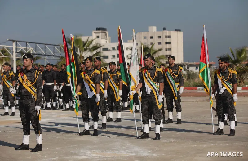 Palestinian members of officer display their skills during a graduation ceremony in Gaza city on November 30, 2014. Photo by Ashraf Amra