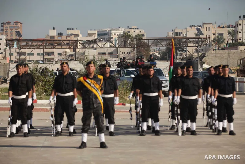 Palestinian members of officer display their skills during a graduation ceremony in Gaza city on November 30, 2014. Photo by Ashraf Amra