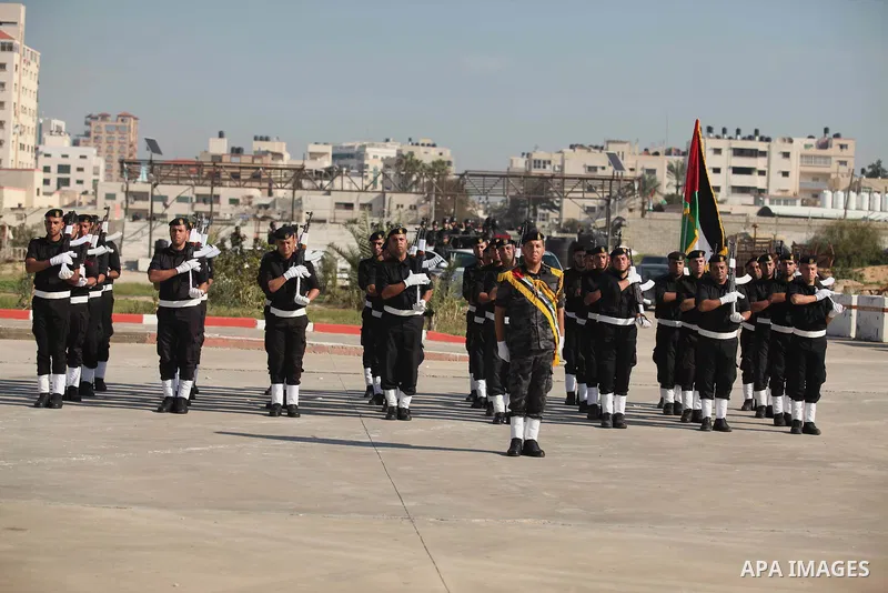 Palestinian members of officer display their skills during a graduation ceremony in Gaza city on November 30, 2014. Photo by Ashraf Amra