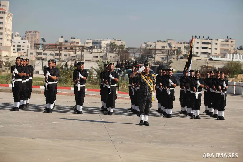 Palestinian members of officer display their skills during a graduation ceremony in Gaza city on November 30, 2014. Photo by Ashraf Amra