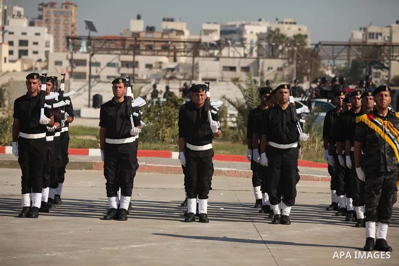 Palestinian members of officer display their skills during a graduation ceremony in Gaza city on November 30, 2014. Photo by Ashraf Amra