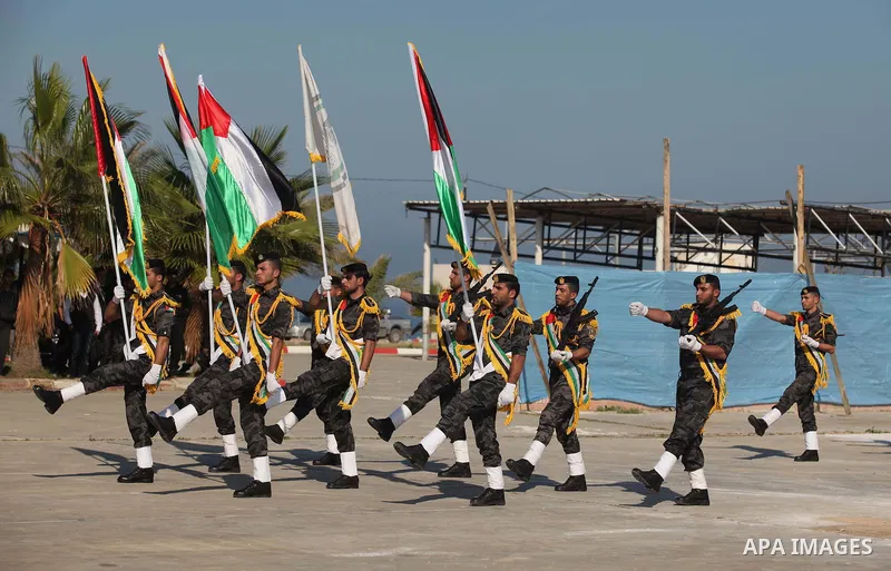 Palestinian members of officer display their skills during a graduation ceremony in Gaza city on November 30, 2014. Photo by Ashraf Amra
