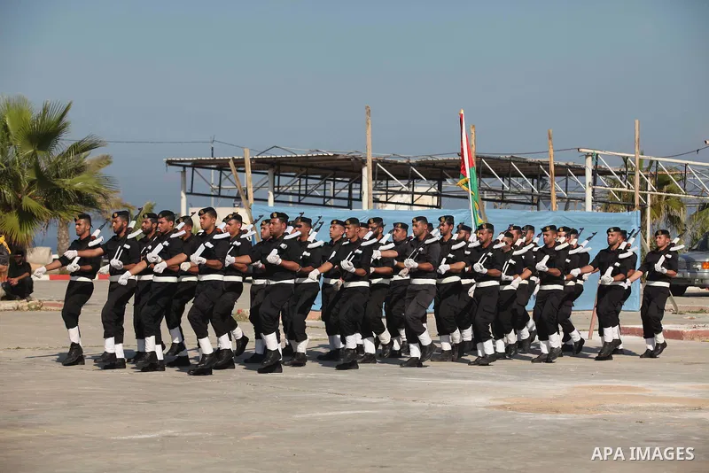 Palestinian members of officer display their skills during a graduation ceremony in Gaza city on November 30, 2014. Photo by Ashraf Amra