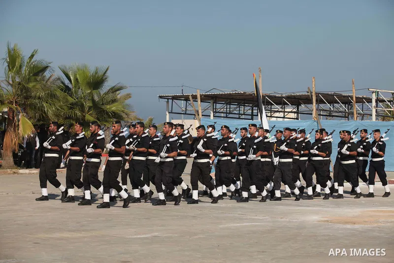 Palestinian members of officer display their skills during a graduation ceremony in Gaza city on November 30, 2014. Photo by Ashraf Amra