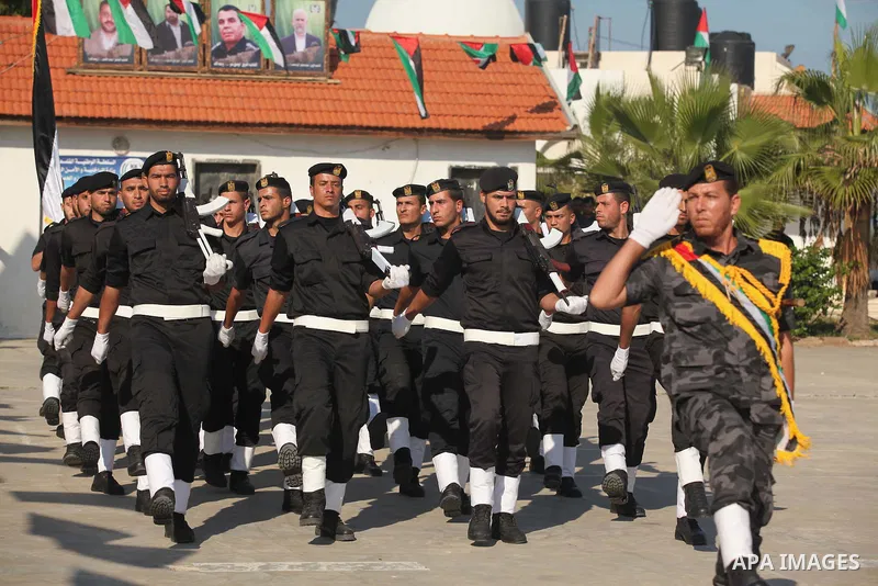 Palestinian members of officer display their skills during a graduation ceremony in Gaza city on November 30, 2014. Photo by Ashraf Amra