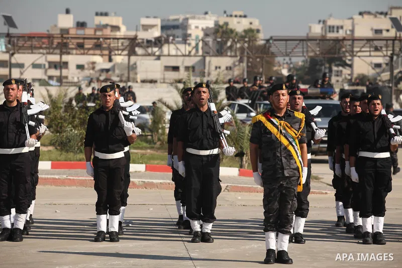 Palestinian members of officer display their skills during a graduation ceremony in Gaza city on November 30, 2014. Photo by Ashraf Amra