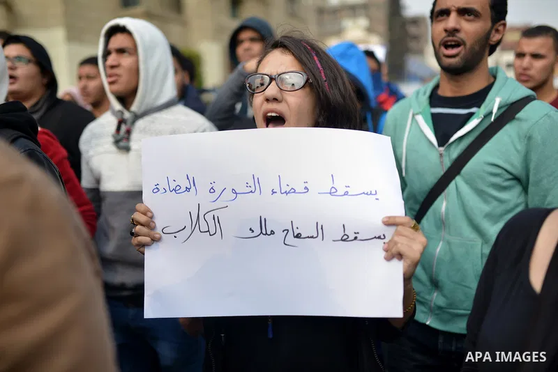Egyptian anti-Mubarak students chant slogans one day after a court dismissed murder charges against former president Hosni Mubarak at Cairo University, Egypt, 30 November 2014. Two people were killed in clashes between p...