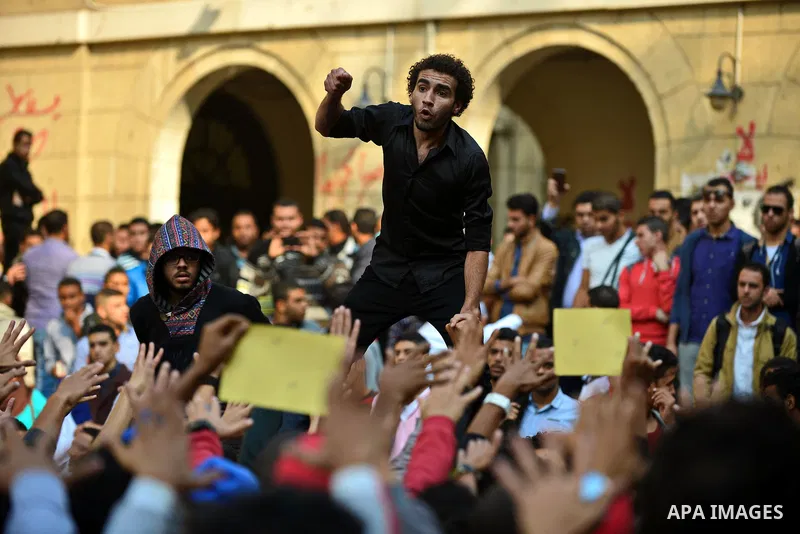 Egyptian student who support Muslim Brotherhood and ousted president Mohammed Mursi, take part in a protest one day after a court dismissed murder charges against former president Hosni Mubarak at Cairo University, Egypt...