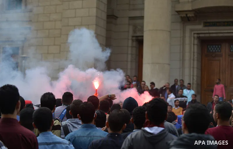 Egyptian student who support Muslim Brotherhood and ousted president Mohammed Mursi, take part in a protest one day after a court dismissed murder charges against former president Hosni Mubarak at Cairo University, Egypt...