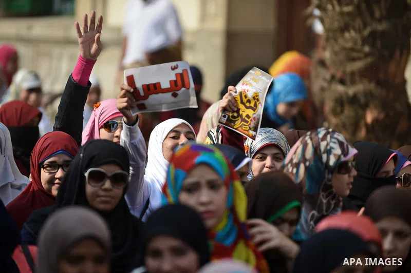 Egyptian student who support Muslim Brotherhood and ousted president Mohammed Mursi, take part in a protest one day after a court dismissed murder charges against former president Hosni Mubarak at Cairo University, Egypt...