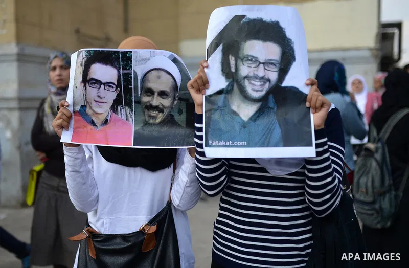 Egyptian student who support Muslim Brotherhood and ousted president Mohammed Mursi, take part in a protest one day after a court dismissed murder charges against former president Hosni Mubarak at Cairo University, Egypt...