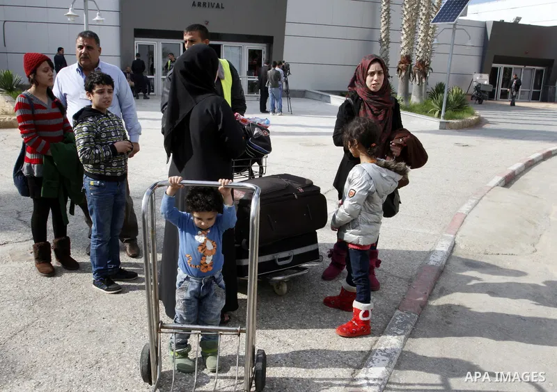 Palestinians cross into Gaza through the Rafah border crossing between Egypt and southern Gaza Strip on November 30, 2014. Egyptian authorities reopened this week the Rafah crossing with Gaza for two days this week to al...