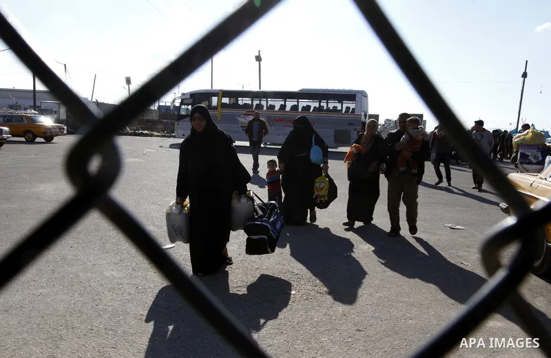 Palestinians cross into Gaza through the Rafah border crossing between Egypt and southern Gaza Strip on November 30, 2014. Egyptian authorities reopened this week the Rafah crossing with Gaza for two days this week to al...