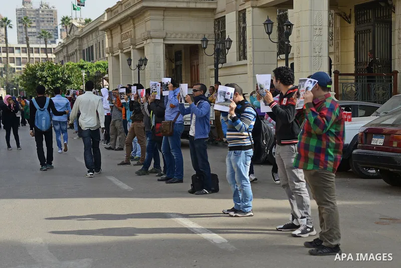 Egyptian students who support Muslim Brotherhood and ousted president Mohammed Morsi, take part in a demonstration to demand for release the detained students, at Cairo University, in Cairo, Dec. 02, 2014. Photo by Amr S...