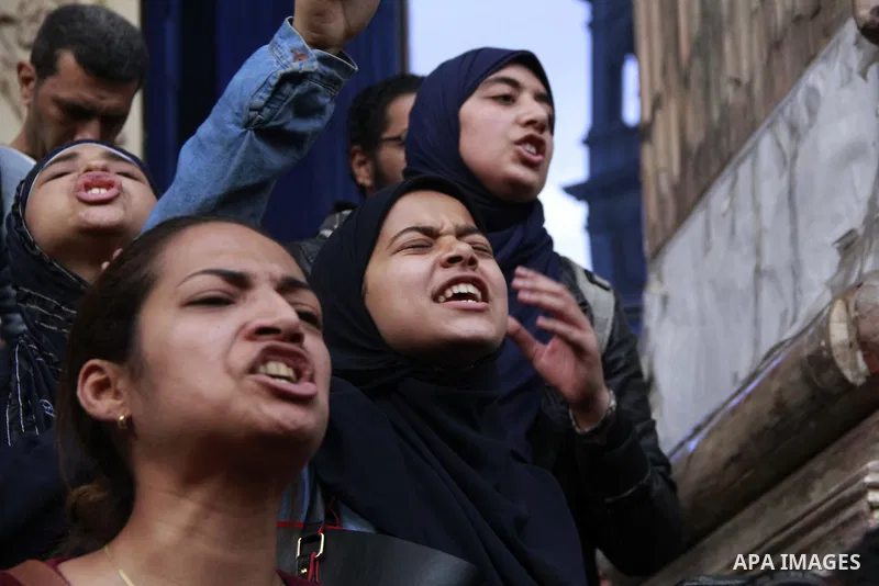Egyptians chant slogans during a protest denouncing toppled President Hosni Mubarak in front of the press syndicate in Cairo, Egypt, Tuesday, Dec. 2, 2014. A judge on Saturday dismissed the case against Mubarak and acqui...