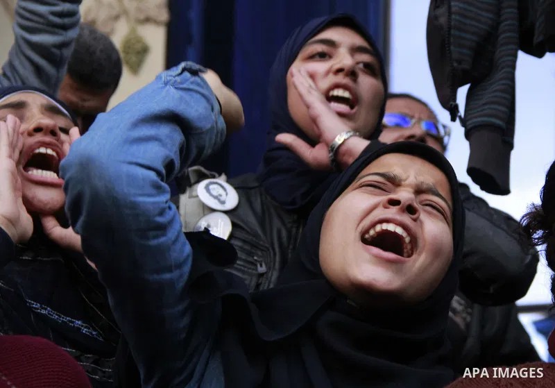 Egyptians chant slogans during a protest denouncing toppled President Hosni Mubarak in front of the press syndicate in Cairo, Egypt, Tuesday, Dec. 2, 2014. A judge on Saturday dismissed the case against Mubarak and acqui...