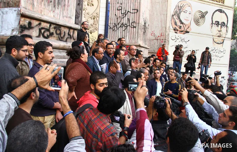 Egyptians chant slogans during a protest denouncing toppled President Hosni Mubarak in front of the press syndicate in Cairo, Egypt, Tuesday, Dec. 2, 2014. A judge on Saturday dismissed the case against Mubarak and acqui...