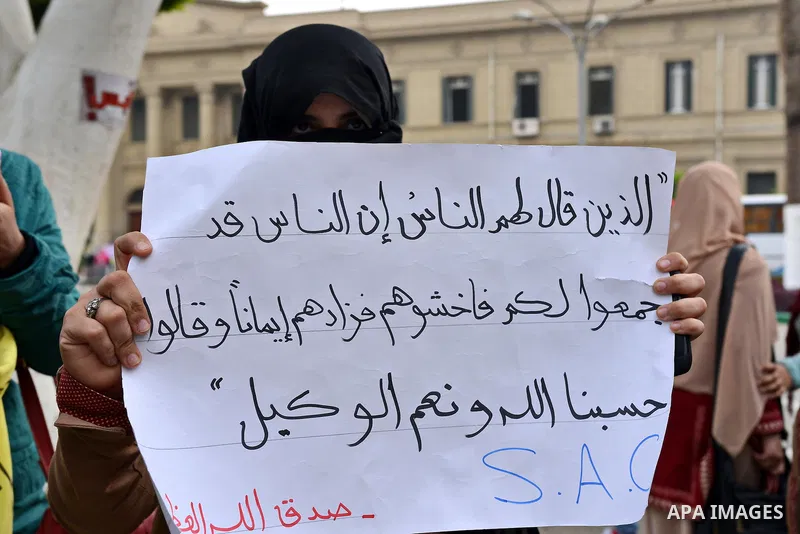 Egyptian students who are members in Students Against the Coup group (SAC), take part in a demonstration against the Cairo Criminal Court's decision to drop charges against former president Hosni Mubarak, at Cairo Univer...