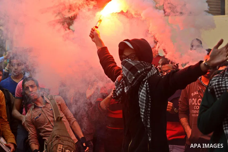 Egyptian students who are members in Students Against the Coup group (SAC), take part in a demonstration against the Cairo Criminal Court's decision to drop charges against former president Hosni Mubarak, at Cairo Univer...