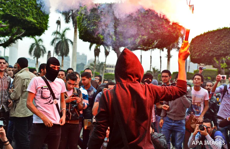 Egyptian students who are members in Students Against the Coup group (SAC), take part in a demonstration against the Cairo Criminal Court's decision to drop charges against former president Hosni Mubarak, at Cairo Univer...