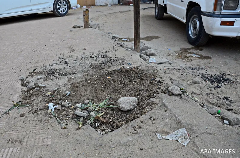 The scene of a bomb after defused by civil protection forces in al-Haram street, near Cairo, December 5, 2014. Photo by Amr Sayed