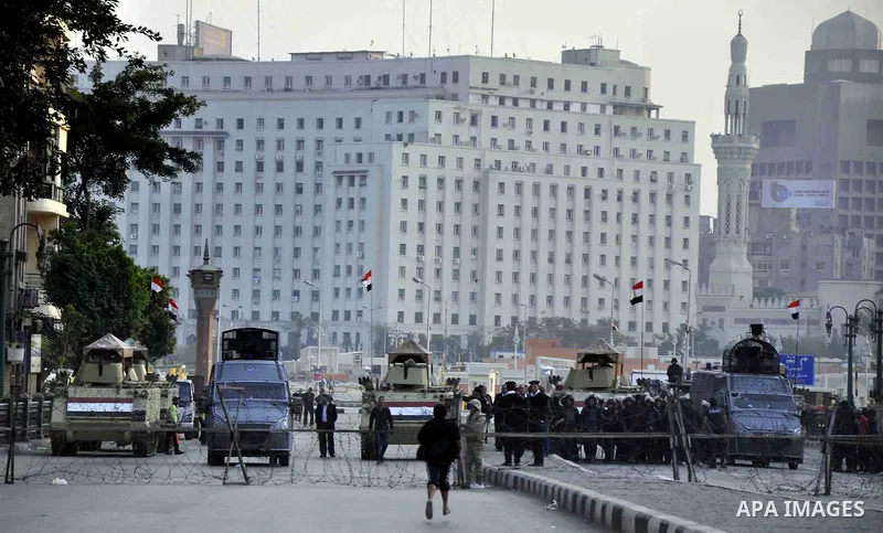 Egyptian army blocks a road leading to Cairo's landmark Tahrir Square on December 5, 2014, during a demonstration against a court's decision to drop a murder charge against ousted president Hosni Mubarak. A Cairo court o...