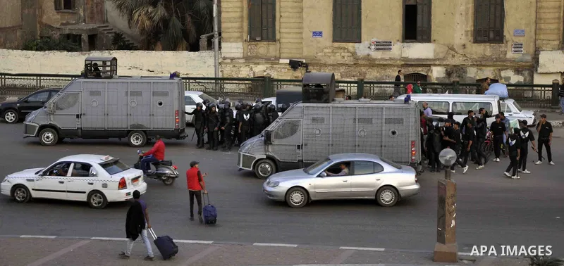 Egyptian police deploy on Abdel Moneim Riad Square in the capital Cairo on December 5, 2014, during a demonstration against a court's decision to drop a murder charge against ousted president Hosni Mubarak. A Cairo court...