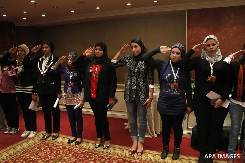 Egyptian women attend a meeting to demand the conscription, during a campaign "an Egyptian soldier" in Cairo, Egypt, on December 5, 2014. Photo by Amr Sayed