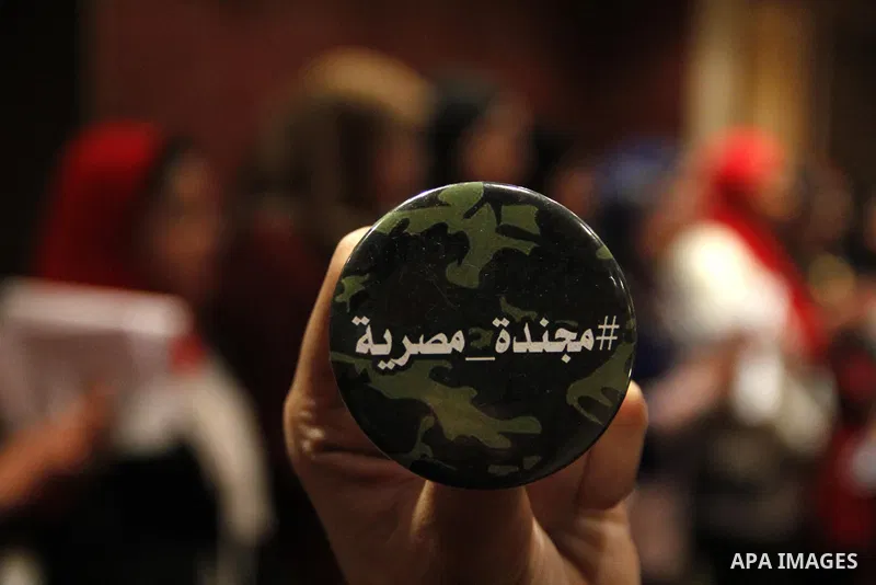 Egyptian women attend a meeting to demand the conscription, during a campaign "an Egyptian soldier" in Cairo, Egypt, on December 5, 2014. Photo by Amr Sayed