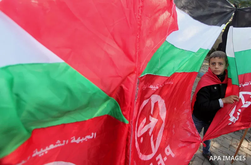 Palestinian supporters of the Popular Front for the Liberation of Palestine (PFLP) gather during a protest against the delay in acquiring building material in front of the United Nations office in Gaza city on December 7...