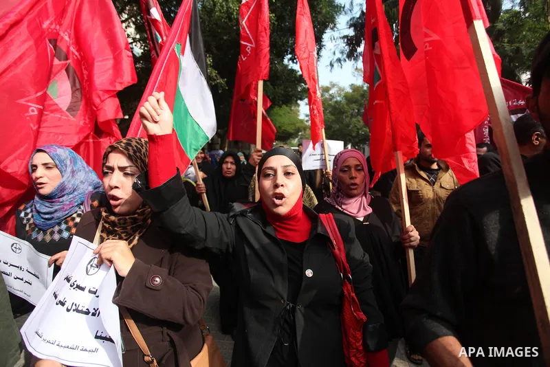 Palestinian supporters of the Popular Front for the Liberation of Palestine (PFLP) gather during a protest against the delay in acquiring building material in front of the United Nations office in Gaza city on December 7...