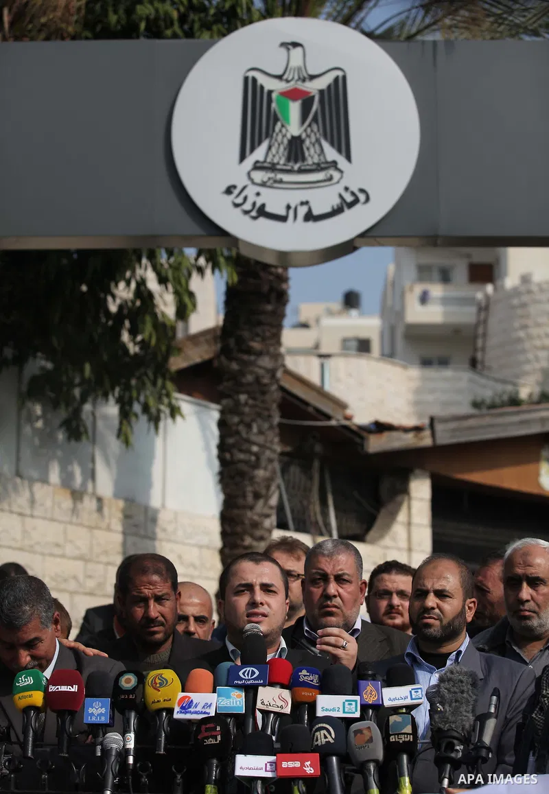 Spokesman of the National Commission to break the siege Adham Abu Salmiya, speaks during a protest against the delay in acquiring building material in front of the headquarters of the Council of Ministers in Gaza city De...