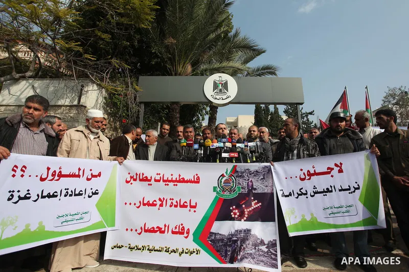 Spokesman of the National Commission to break the siege Adham Abu Salmiya, speaks during a protest against the delay in acquiring building material in front of the headquarters of the Council of Ministers in Gaza city De...