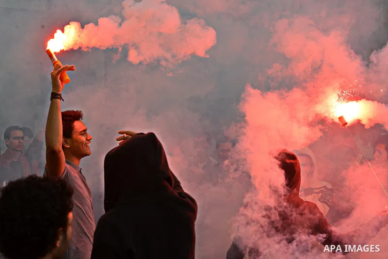 Egyptian students, who are members of Students Against the Coup group (SAC), take part in a demonstration against the military rule, at Cairo University on December 9, 2014. Photo by Amr Sayed