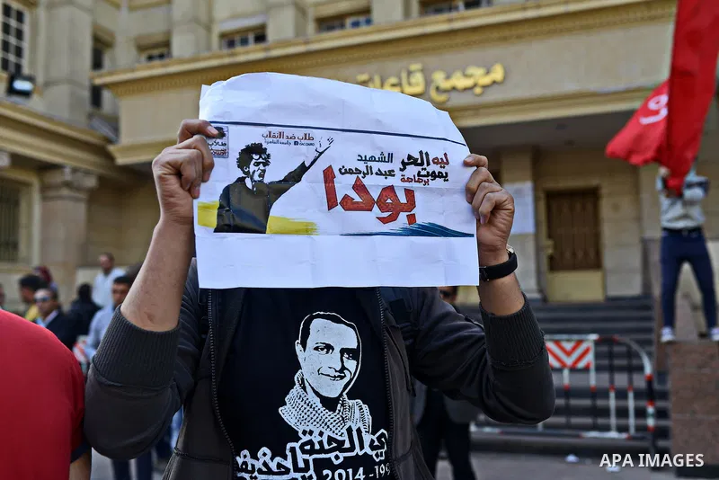 Egyptian students, who are members of Students Against the Coup group (SAC), take part in a demonstration against the military rule, at Cairo University on December 9, 2014. Photo by Amr Sayed