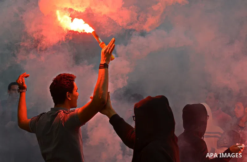 Egyptian students, who are members of Students Against the Coup group (SAC), take part in a demonstration against the military rule, at Cairo University on December 9, 2014. Photo by Amr Sayed