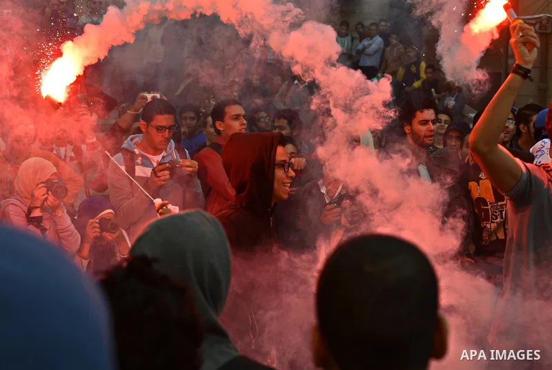 Egyptian students, who are members of Students Against the Coup group (SAC), take part in a demonstration against the military rule, at Cairo University on December 9, 2014. Photo by Amr Sayed