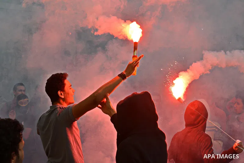 Egyptian students, who are members of Students Against the Coup group (SAC), take part in a demonstration against the military rule, at Cairo University on December 9, 2014. Photo by Amr Sayed