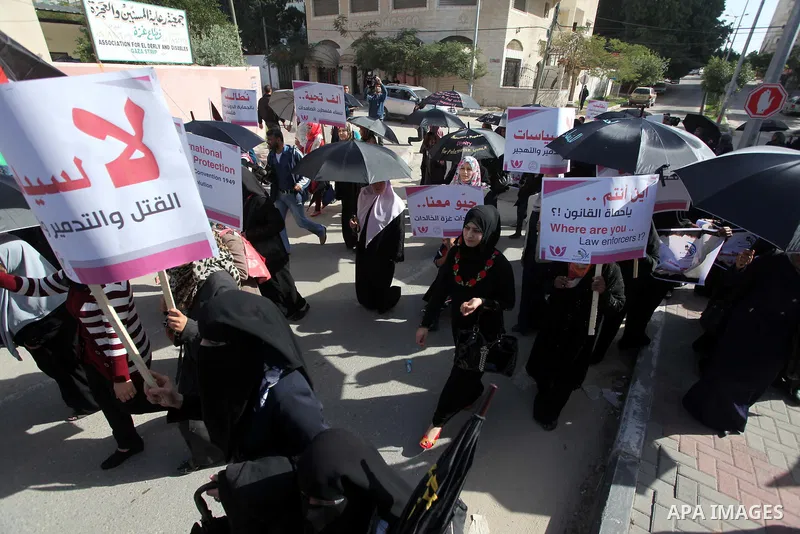 Palestinian women take part in a demonstration to mark the International Day of Human Rights, in Gaza City on December 10, 2014. The Palestinians are seeking a UN resolution by year-end that would set a timetable for Isr...