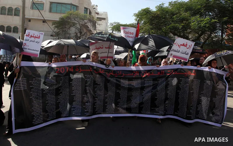Palestinian women take part in a demonstration to mark the International Day of Human Rights, in Gaza City on December 10, 2014. The Palestinians are seeking a UN resolution by year-end that would set a timetable for Isr...