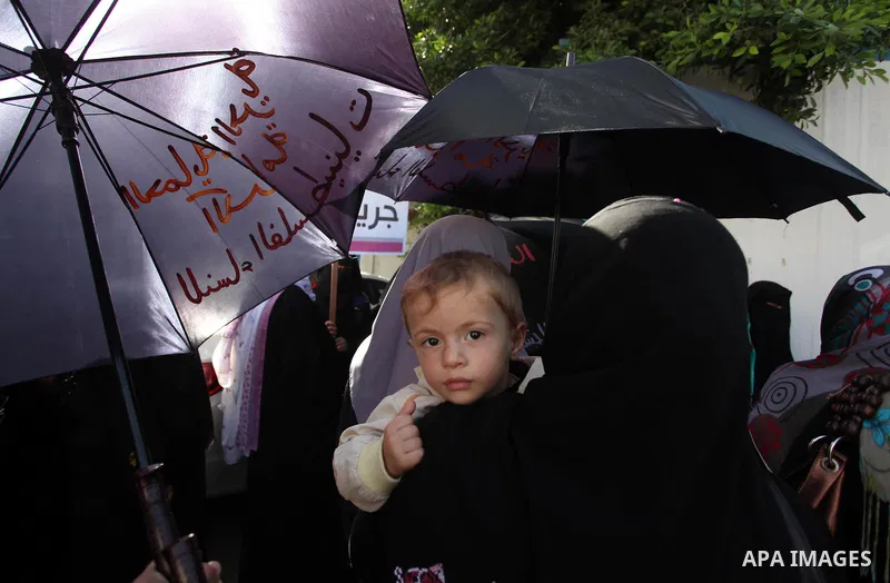 Palestinian women take part in a demonstration to mark the International Day of Human Rights, in Gaza City on December 10, 2014. The Palestinians are seeking a UN resolution by year-end that would set a timetable for Isr...
