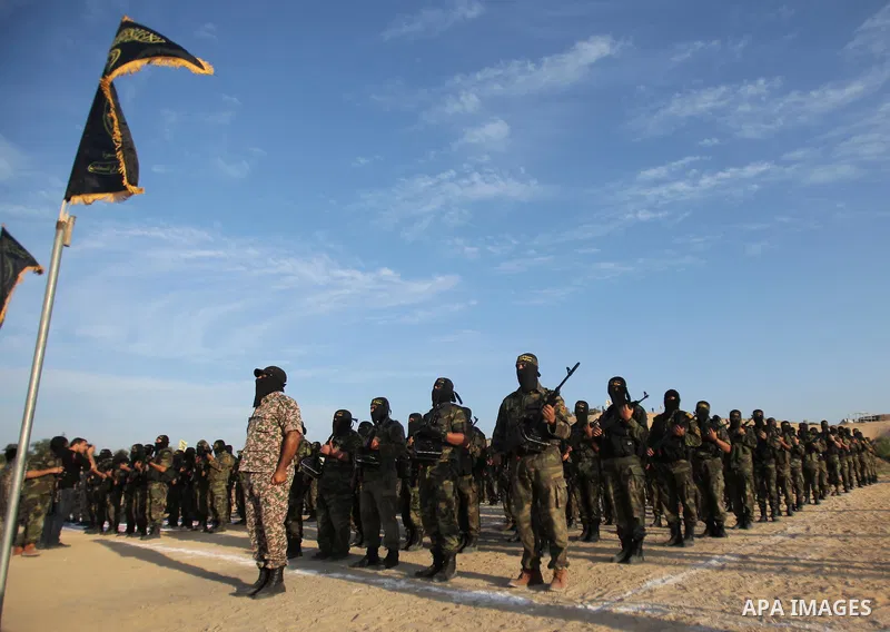 Palestinian militant from the al-Quds brigade, the armed wing of Islamic Jihad movement, take part in a training exercise, in Deir al-Balah, in the center of Gaza Strip, December 11, 2014. Hamas says a senior U.N. envoy...
