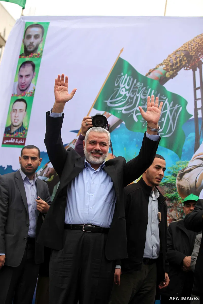 Senior Hamas leader Ismail Haniyeh, takes part in a rally ahead of the 27th anniversary of the movement founding, in Jabaliya in the northern Gaza Strip December 12, 2014. Photo by Ashraf Amra