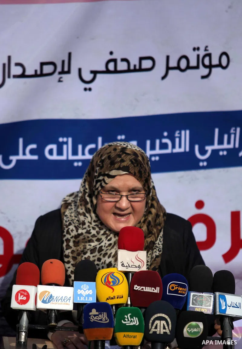 Palestinian minister of women affairs Haifaa al-Agha, speaks during a media conference in front of the Italian Complex, which was destroyed by Israeli air strike during the Israel-Gaza conflict, in Gaza city on December...