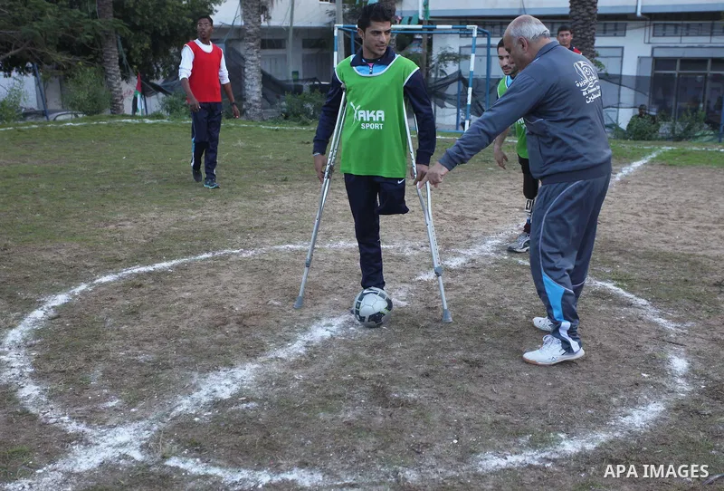 Palestinians disabled participate in an athletics championship for disabled, at Al-Jazeera Club in Gaza city on December 20, 2014. Photo by Ashraf Amra